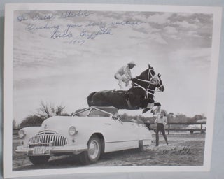 Item #016160 Rodeo Hall of Famer Dick Griffith on His horse leaping Over convertible (inscribed...