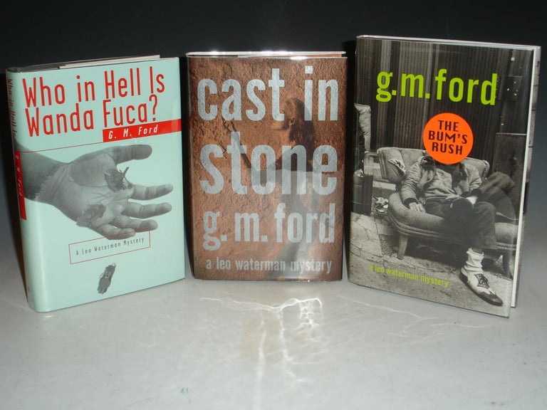 Item #021163 Who in Hell is Wanda Fuca?; Cast in Stone and The Bum's Rush (author's First, Second and Third Book, each signed). G. M. Ford.