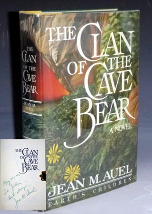 Item #028797 The Clan of the Cave Bear (inscribed: To John, Best, Jean M. Auel, November 1982)....